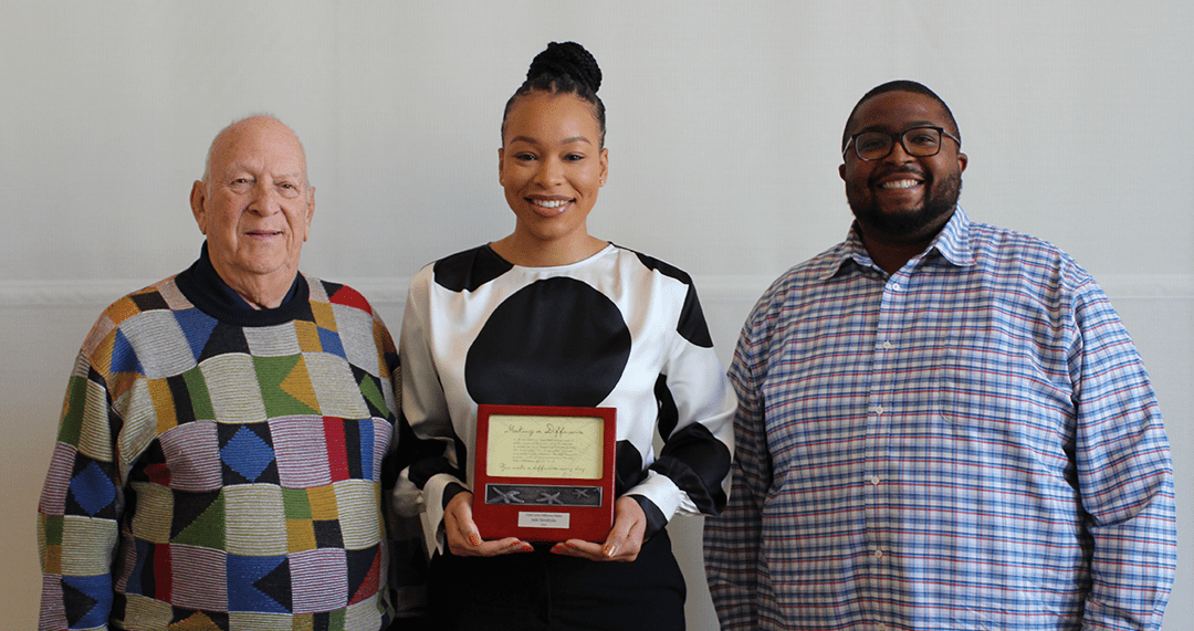 Jade I. Hendricks accepting the 2022 Lloyd Levin Difference Maker Individual Award with Lloyd Levin and Jeremy Cain