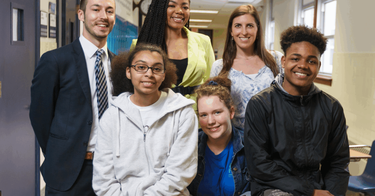 students grouped together in a school hallway