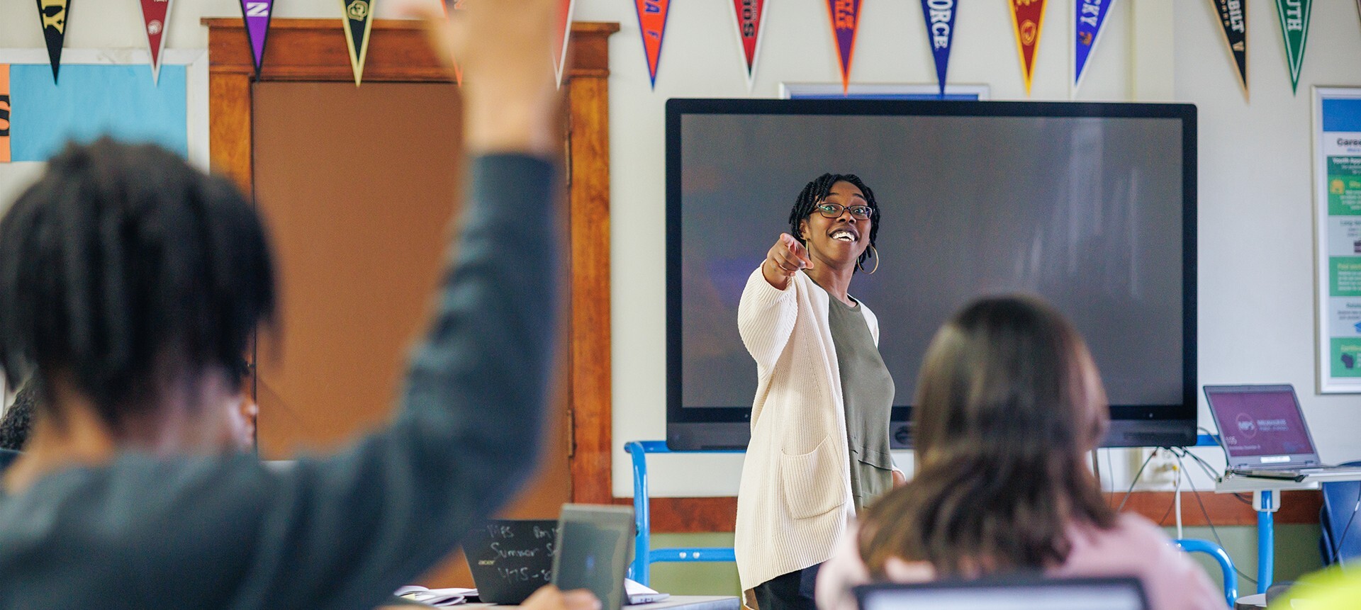 Volunteer leading the Money Coach class session