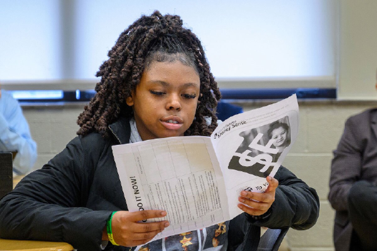 Girl reviewing program brochure