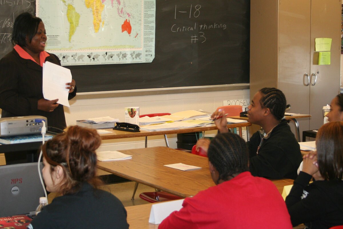 Coach giving a lesson in classroom