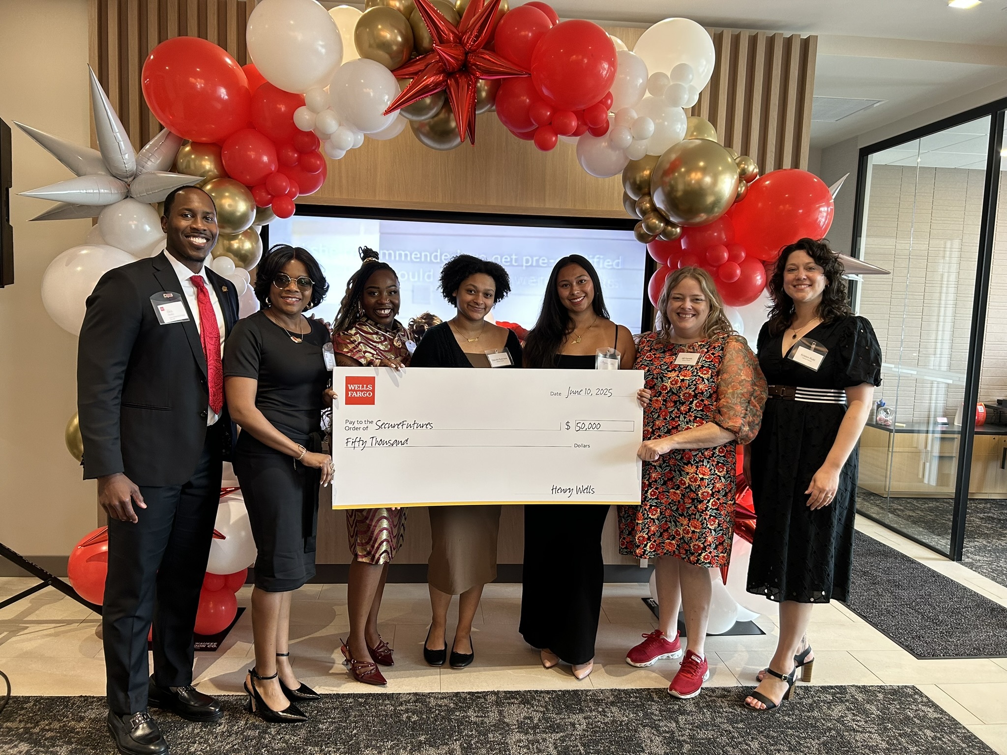 Wells Fargo Bank Check Presentation with SecureFutures staff and alumni
