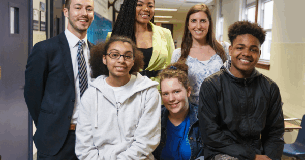 students grouped together in a school hallway